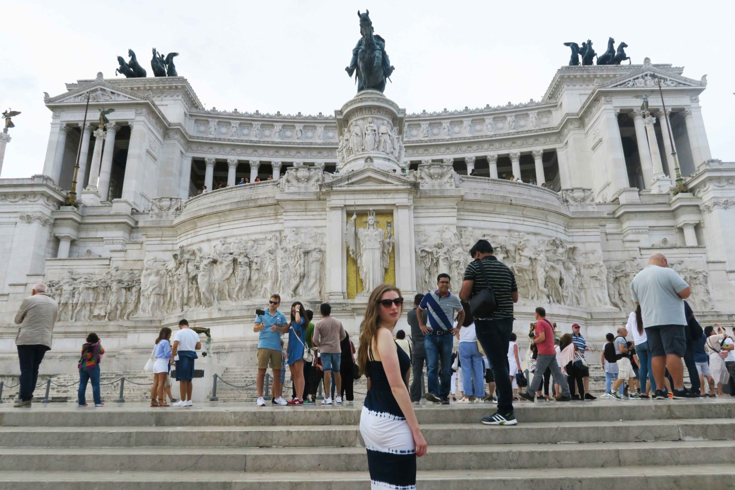 melissa carne walking up steps to roman palace in rome