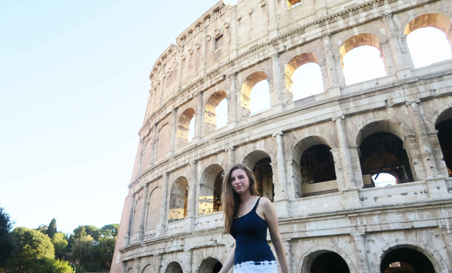 melissa carne standing in front of the colosseum in rome in italy