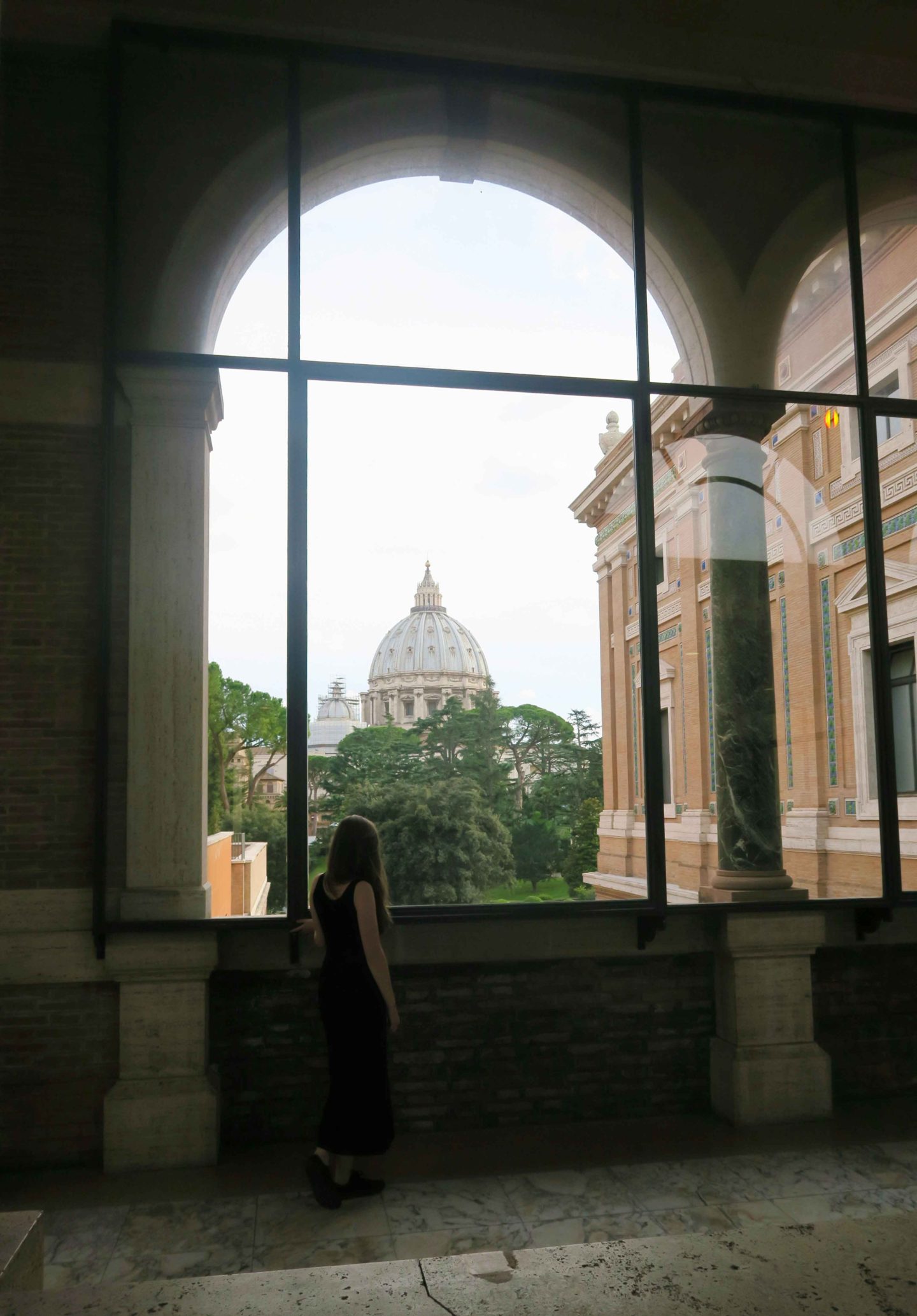 vatican museum window looking at the vatican in rome