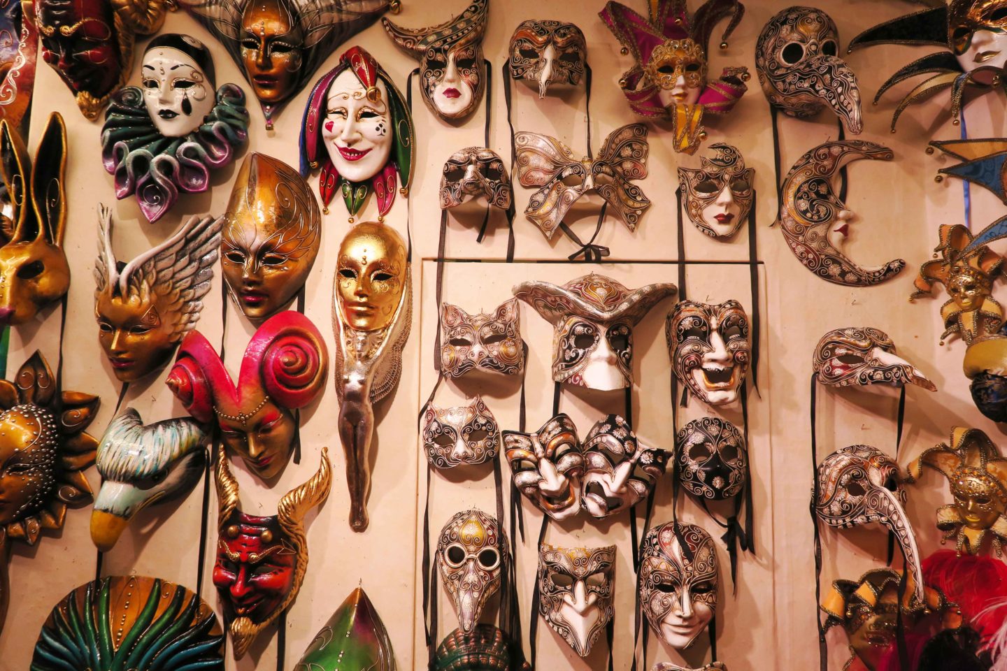 venitian masks on wall in gift shop in venice in italy
