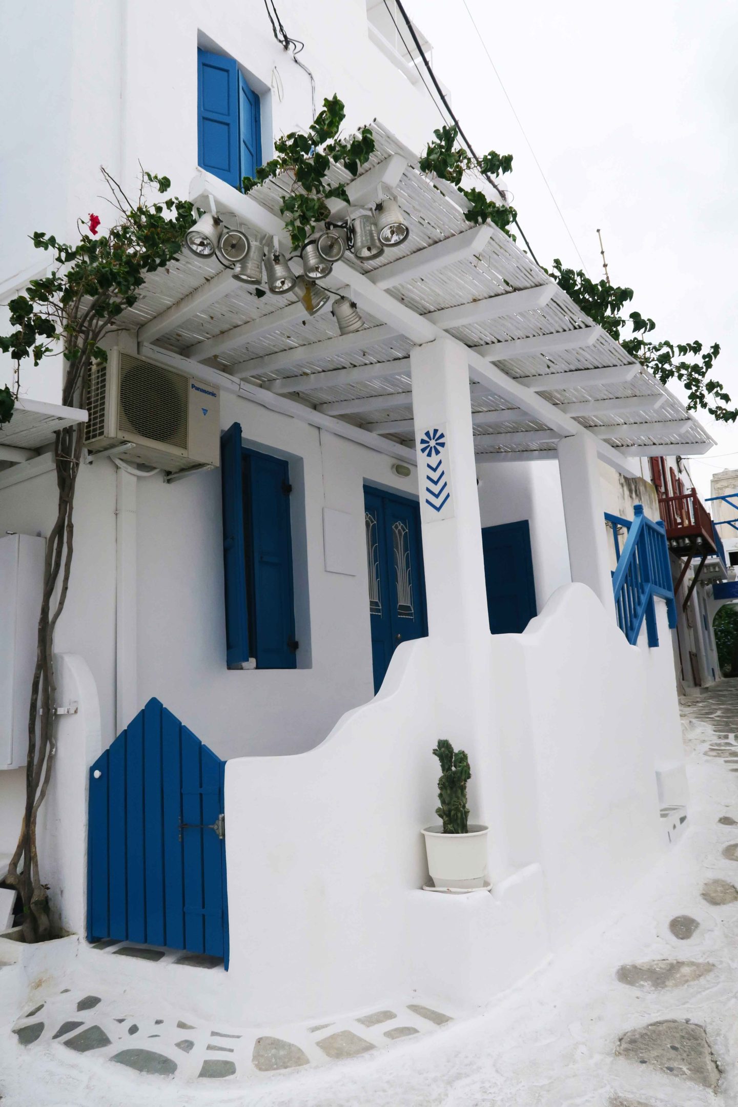 greek white and blue house on the corner of mykonos town
