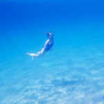 girl underwater snorkel mykonos greece