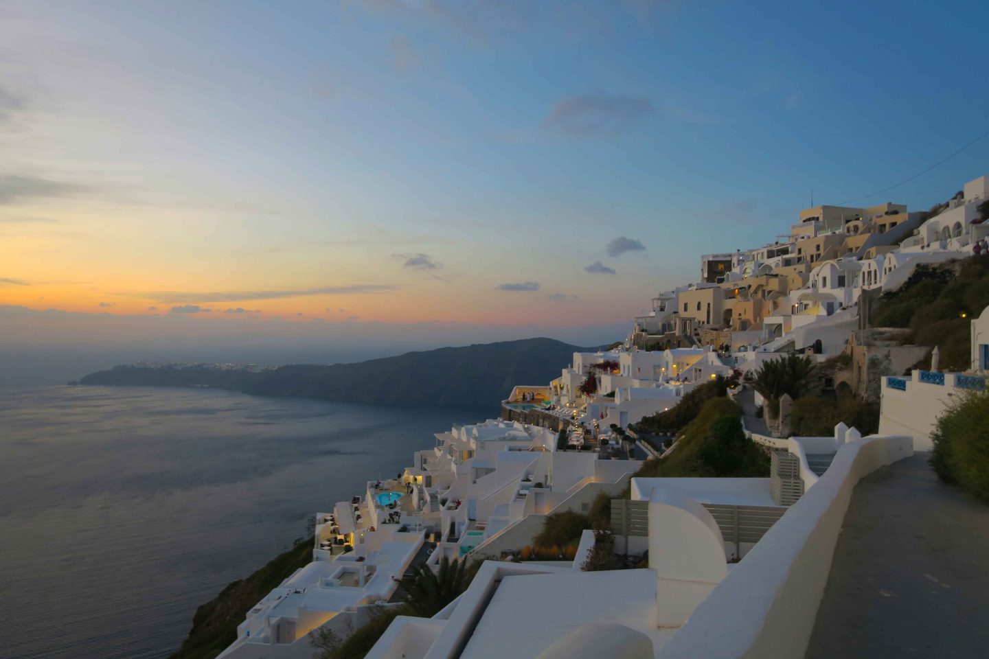 the town of oia in santorini at dusk