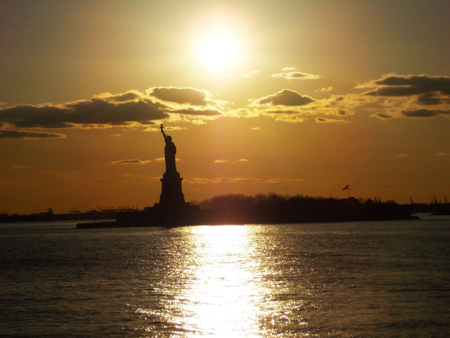 statue of liberty at sunset in new york