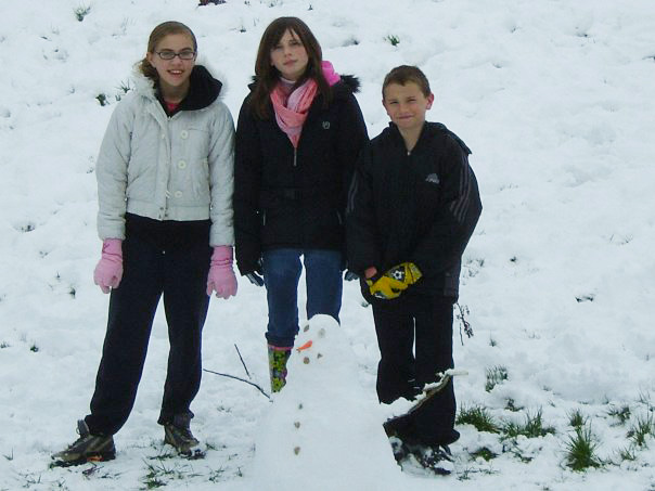 children building snowman