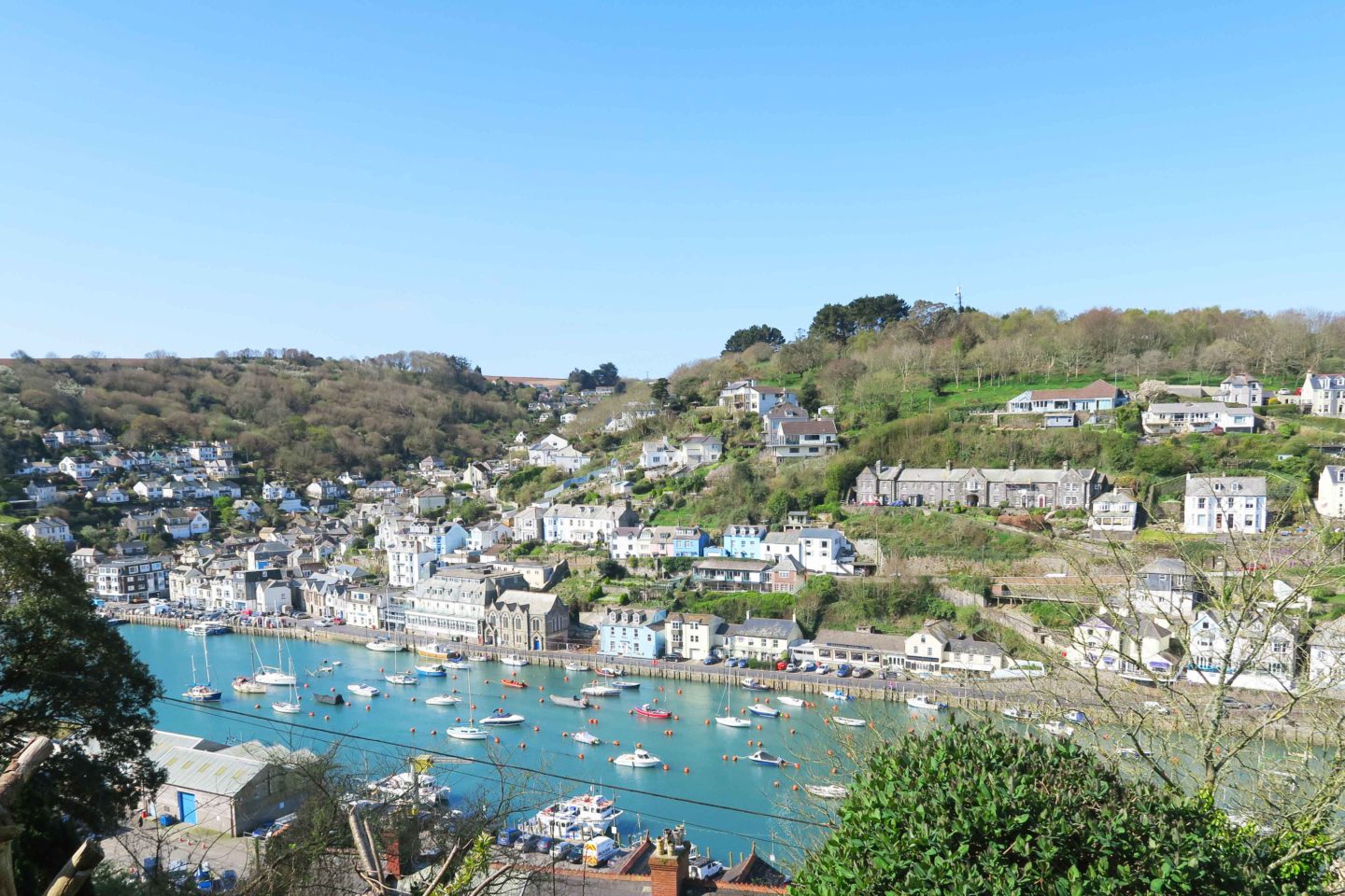 view of looe river with the tide in on a sunny day in cornwall