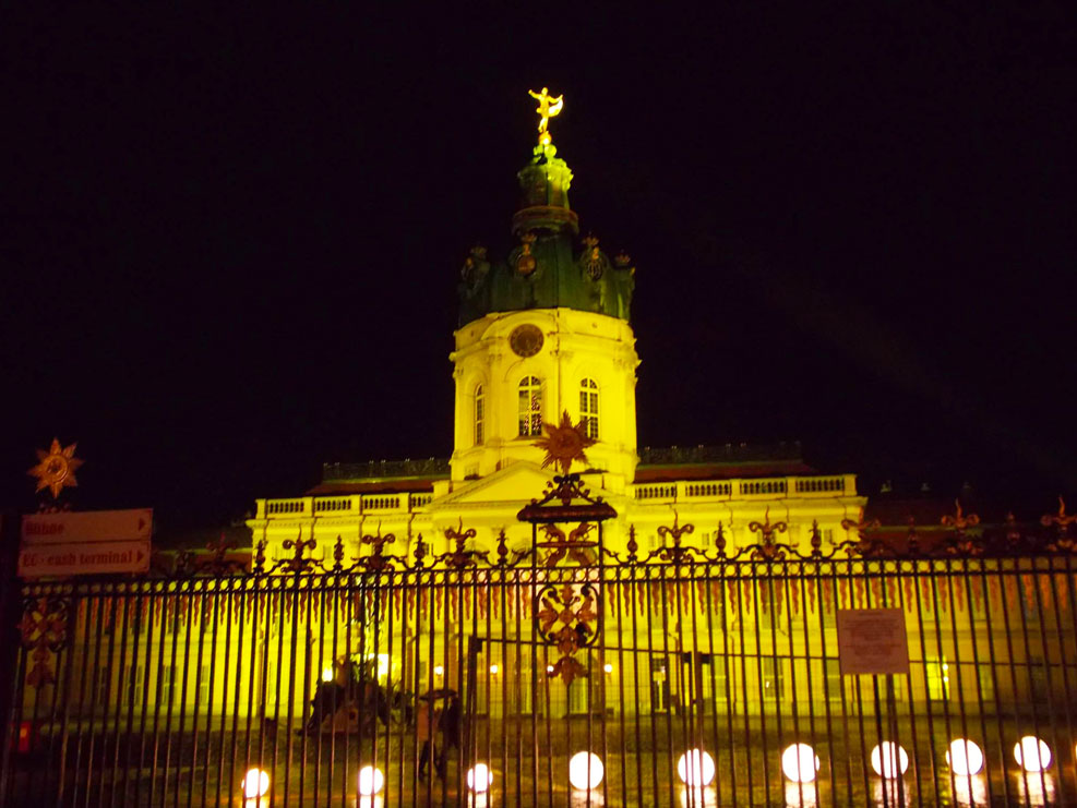 berlin palace lit up at the german christmas markets