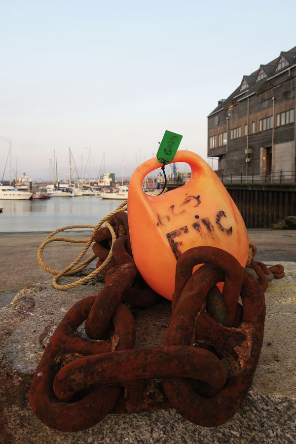 rust chain and buoy in falmouth harbour