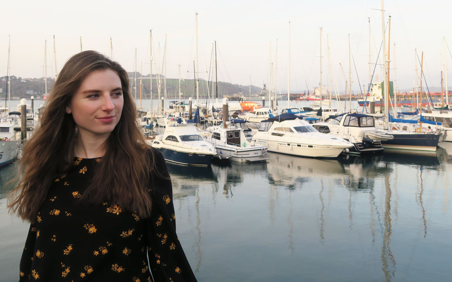 melissa carne standing in front of boats in falmouth harbour