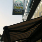 harbour lights fish and chips sign and shop front in falmouth in cornwall