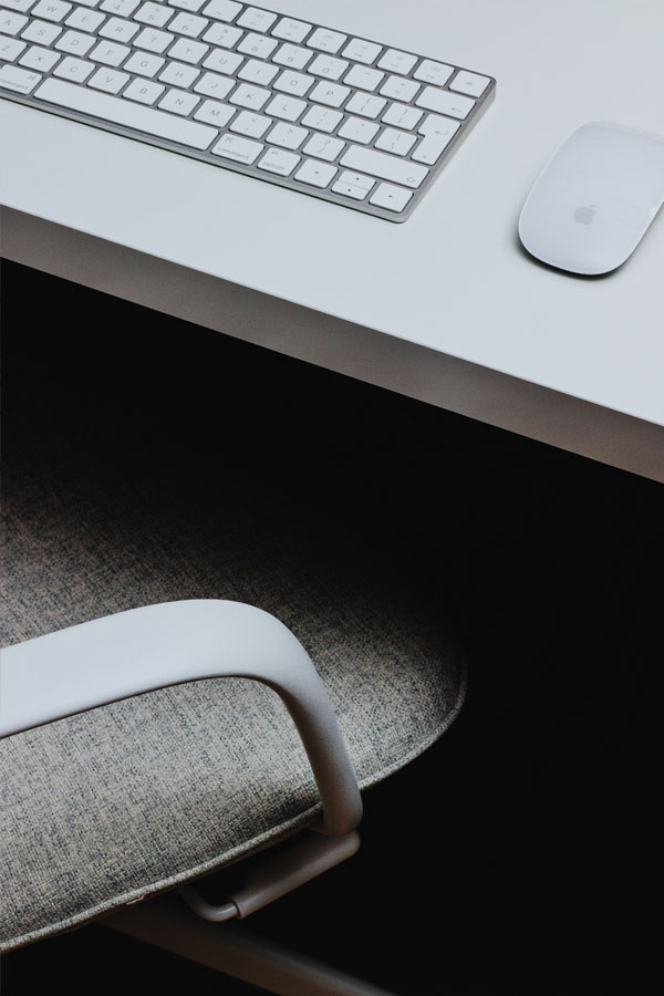 office chair and mac keyboard and mouse