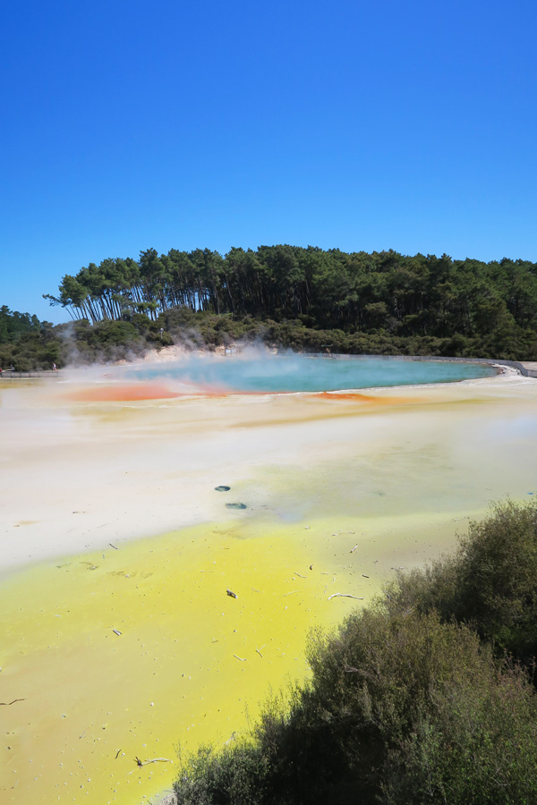 yellow, orange and blue lake called the artists palette in rotorua