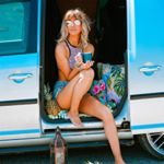 charlotte lodey from the palm tree club sitting in a van