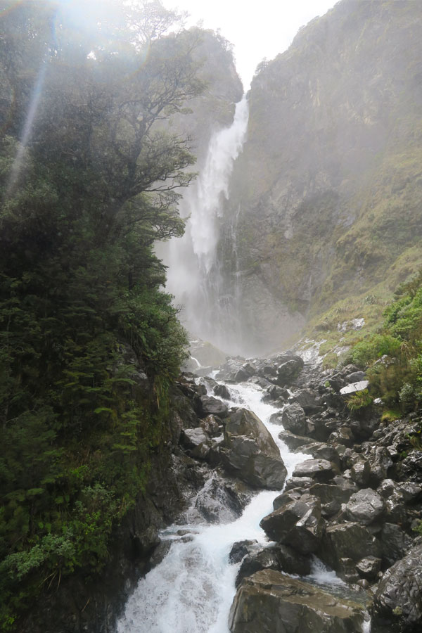 the devil's punchbowl waterfall in Arthur's Pass, New Zealand