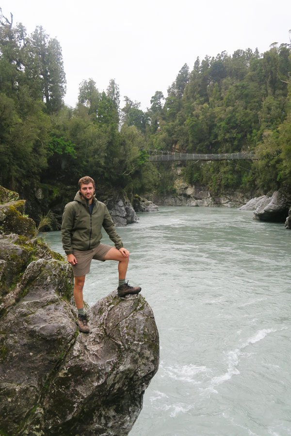 Sam Gill on rock at Hokitika Gorge in Ne Zealand