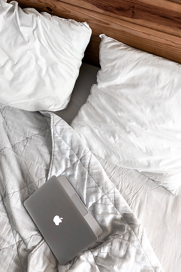 silver macbook on white bedding, graphic design essential