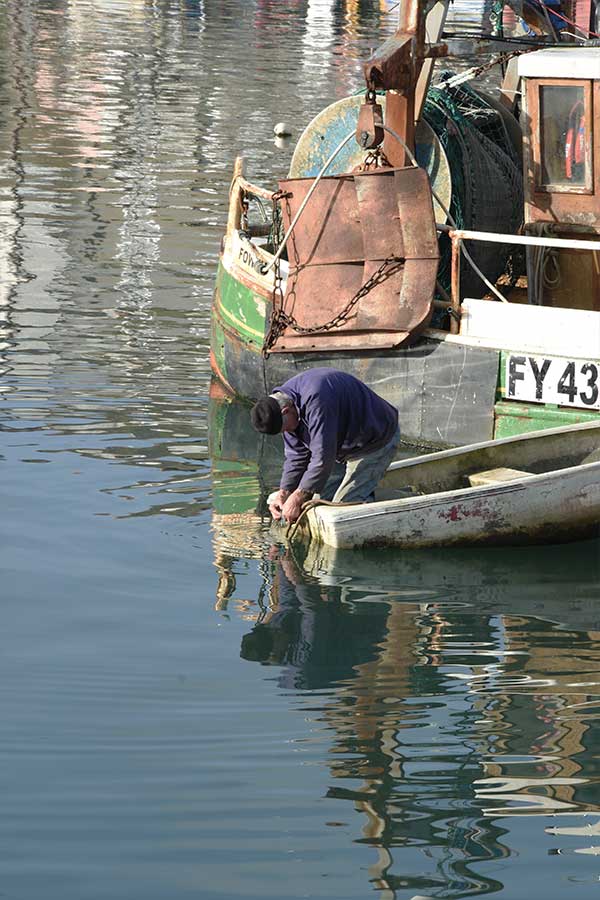 fisherman on fishing boat in mevagissey