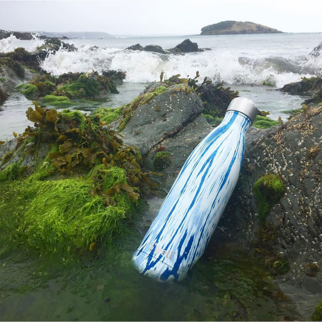 swell reusable bottle in rock pool in cornwall